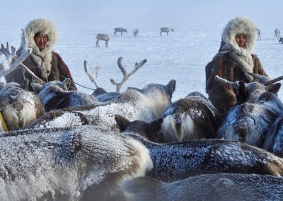 Seyakha Nenets women wearing traditional women's hats made of reindeer fur and lined with Arctic fox fur